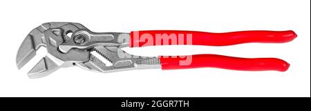 Adjustable wrench or tongue-and-groove pliers. Metal hand work tool with opened jaws and red plastic handles. For holding or gripping and tightening. Stock Photo