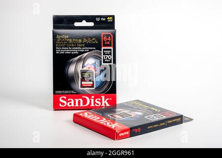 Two EXTREME PRO 64GB SD memory card boxes isolated on white. Selective focus. Stafford, September 2, 2021 Stock Photo