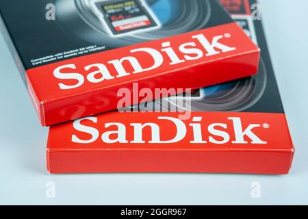 SanDisk logos seen on the boxes with EXTREME PRO 64GB SD memory cards. Selective focus. Stafford, September 2, 2021 Stock Photo