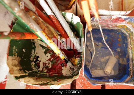 colourful rollers and paint bucket in the boatswain store Stock Photo