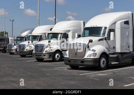 Indianapolis - Circa September 2021: Navistar International Semi Tractor Trailer Trucks lined up for Sale. Stock Photo