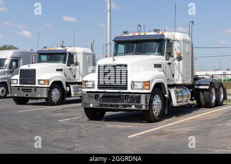 Indianapolis - Circa September 2021: Mack Semi Tractor Trailer Trucks Lined up for sale. Mack Trucks is owned by Volvo. Stock Photo