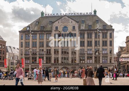 Amsterdam, Netherlands - August 14, 2021: Brown stone Peek and Cloppenburg building on Dam square housing Madame Tussaud wax museum. Clothing of lots Stock Photo