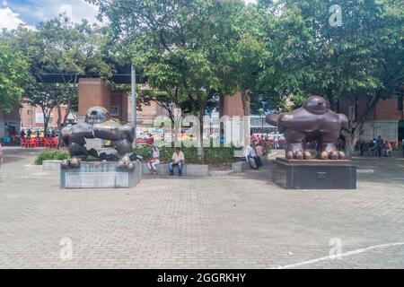 MEDELLIN, COLOMBIA - SEPTEMBER 1, 2015: Twin statues of Bird of Peace in San Antonio park by Fernando Botero. One of them was destroyed by bomb explos Stock Photo