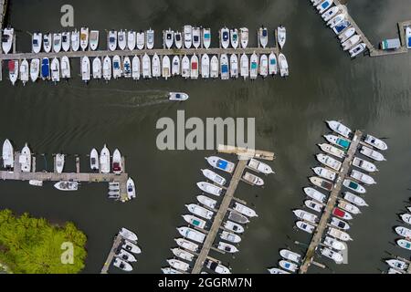 Amazing panoramic view little harbour for many boat floating near the ocean in USA Stock Photo