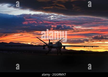 The U.S. Air Force General Atomics MQ-9 Reaper unmanned aerial vehicle at sunset on the flight line at Creech Air Force Base November 20, 2019 in Indian Springs, Nevada. Stock Photo