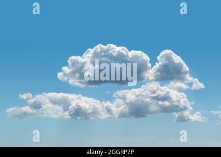 Blue sky with fluffy cumulus clouds texture background  Stock Photo