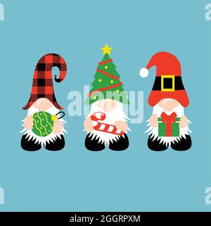 Christmas Gnomes with candy cane, gift, and ornament Stock Photo