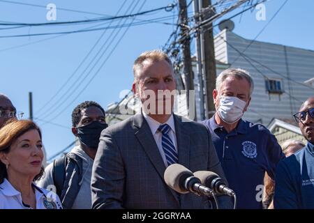 New York City Police Commissioner Dermot Shea speaks at a press conference in Queens addressing the impact of Hurricane Ida's remnants in New York City. Governor Kathy Hochul, Senator. Charles Schumer, and Mayor Bill de Blasio joined other officials standing near a home where Phamatee Ramskriet and Khrishah Ramskriet were killed when their basement apartment was flooded in the Jamaica neighborhood of the Queens discuss future preparations, and the toll of the storm. The remnants of Hurricane Ida dumped historic rain over New York City as freeways and boulevards turned into rivers, submerging Stock Photo