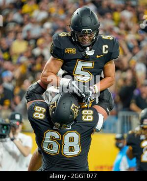 Charlotte, North Carolina, USA. 2nd Sep, 2021. Appalachian State Mountaineers wide receiver Thomas Hennigan (5) celebrates a touchdown reception with Appalachian State Mountaineers offensive lineman Isaiah Helms (68) during the 2021 Duke's Mayo Classic at Bank of America Stadium in Charlotte, North Carolina. Rusty Jones/Cal Sport Media/Alamy Live News Stock Photo