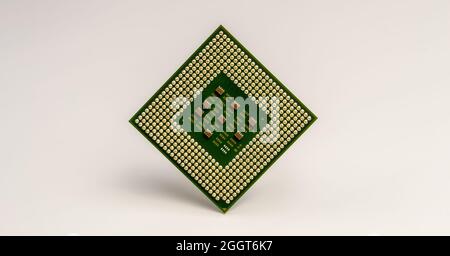 close-up of computer central processor unit with golden pins on white background Stock Photo
