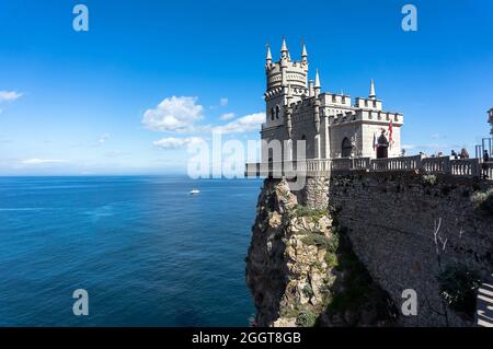 swallow's nest is an ancient castle on a rock, the symbol of the Republic of Crimea on the background of blue sea. Yalta Stock Photo