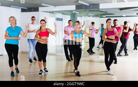 adults of different ages dancing at dance class Stock Photo