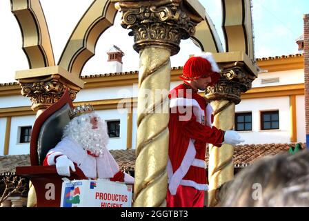 Three Kings Parade with Melchor sitting in his carriage, La Cala de Mijas, Costa del Sol, Malaga Province, Andalusia, Spain. Stock Photo