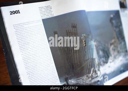 2001 - magazine article with photograph showing the skeletal remains of The World Trade Centre after the terrorist attacks of September 11, 2001. Manhattan, New York. Guardian newspaper weekend supplement : The Year in Pictures with essay by Alan Rusbridger Stock Photo