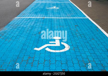 Handicap parking spots with blue and white painted marking Stock Photo