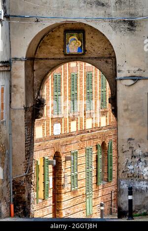 Palazzo Piacentini seen through the arch of Via Gioaccchino Rossini, San Benedetto del Tronto, Italy Stock Photo