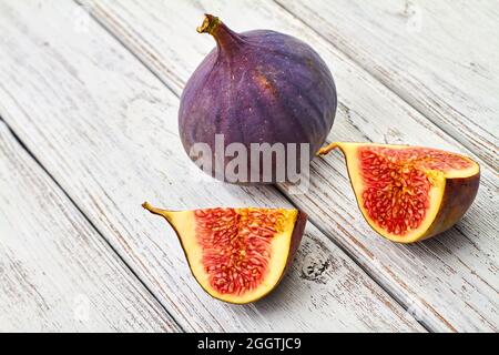 Fresh figs on gray wooden background Stock Photo