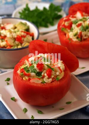 Filled tomatoes with rice, surimi and veggies. Stock Photo