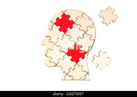 Human head silhouette puzzle with two final pieces to be set in place isolated on white background. Communication disorder concept. Stock Photo