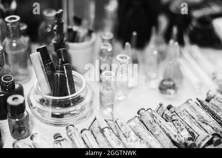 German Deutsch Wehrmacht World War II Times Many Old Medical Glass Capacity. Small Vintage Bottles And Glassware In Different Sizes. Ointment For Stock Photo