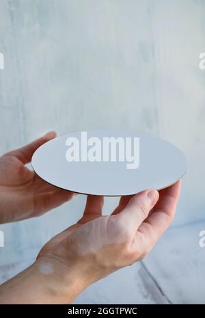 template for advertising your products with empty white tray in womans hands Stock Photo