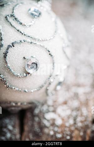 Christmas ball on snow flakes. Selective focus. Shallow depth of field. Stock Photo