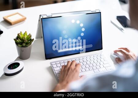 Business Computer Online Update. Software Upgrade Progress Stock Photo
