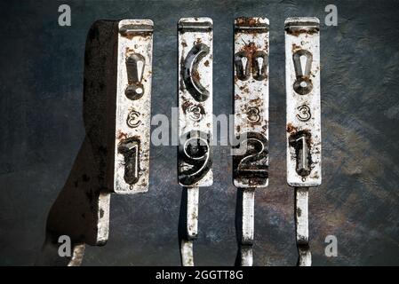 vintage old typewriter hammers with the date 1921 isolated Stock Photo