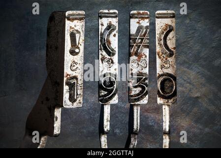 vintage old typewriter hammers with the date 1930  isolated Stock Photo