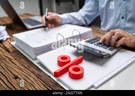 Calculating VAT Tax Percentage And Invoice Discount Stock Photo
