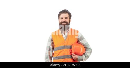 Builder in hard hat, foreman or repairman in the helmet. Bearded man worker in building helmet or hard hat. Portrait of a builder smiling. Worker in Stock Photo