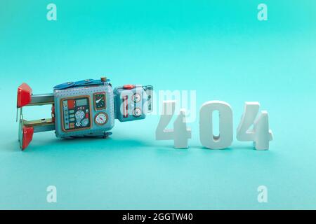 Page not found template. Robot toy repairman. 404 error warning message. Stock Photo