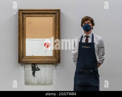EMBARGOED till 12 noon 03 September 2021 - London, UK. 3rd Sep, 2021. Banksy's Love is in the bin, a painting shredded by the artist in Sotheby's london auction room in 2018. It is to be offered in the contemporary art evening auction on october 14 with an estimate of £4-6 million. It sold in 2018 for £1m. On show at Sotheby's New Bond Street Galleries, London. The sale takes place on 14 Oct. Credit: Guy Bell/Alamy Live News