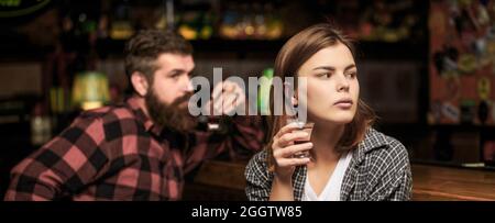 Young woman has problems with alcohol. Alcoholism, alcohol addiction, male alcoholic. Young man drinking alcohol. Female male alcoholism. Woman and Stock Photo
