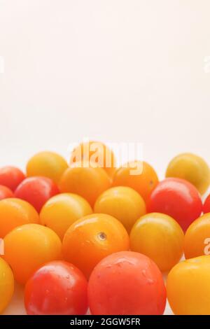 red and yellow color cherry tomato isolated on white  Stock Photo