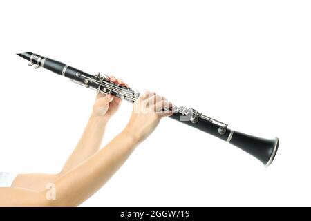 Female hands hold clarinet, isolated on white background Stock Photo