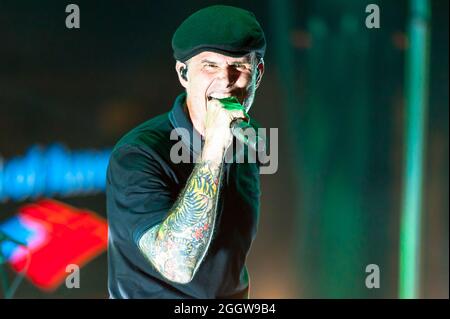 Al Barr, lead singer for the Dropkick Murphys, singing for a stadium full  of fans at Fenway Park, Boston Stock Photo - Alamy