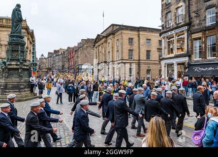 Royal Mile, Edinburgh, Scotland, United Kingdom, 3rd September 2021. Royal Scots Dragoon Guards parade: the  accompanied by their pipes and drums and mounted grey horses parade to celebrate the 50th anniversary of their amalgamation (merged in 1971 from the Royal Scots Greys and the 3rd carabiners. Pictured: the veterans march out from Parliament Square to join the parade Stock Photo