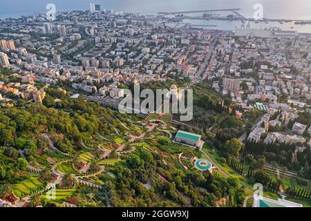 Bahai temple and gardens and Downtown Haifa at sunrise, Aerial image. Stock Photo