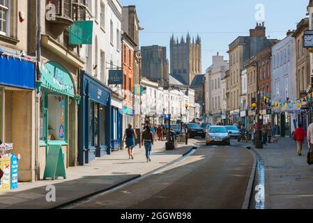 Wells UK, view in summer of the High Street leading up to the historic cathedral in the centre of Wells, Somerset, England, UK Stock Photo