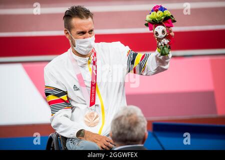 Paralympian athlete Roger Habsch , winner of the bronze medal pictured on the podium of the final of the Men's 100m T51 athletics event on day ten of Stock Photo