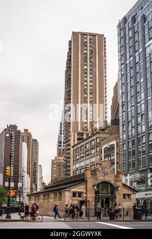 New York City, New York - June 12, 2021:  Manhattan Street scene at the 72nd Street subway station with people and cars visible. Stock Photo