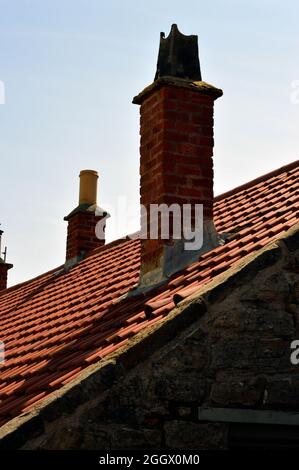 WHITLEY BAY. TYNE and WEAR. ENGLAND. 05-27-21. St. Mary's Island wildlife reserve on the North Sea coast. Tiled roof and chimneys on a stone cottage. Stock Photo