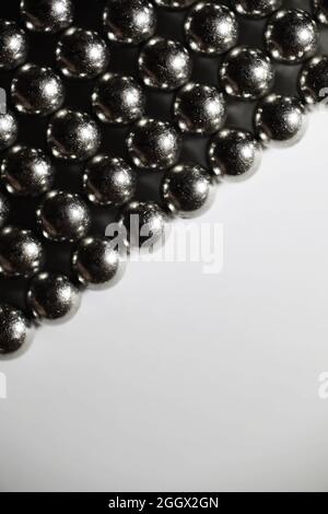 Metal balls close up. Balls of neodymium (magnets). magnetic ball bearing tiling in perfect hexagonal grid Stock Photo