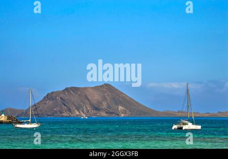 Isla de Lobos with boats a volcanic island off the coast of Fuerteventura one of the Canary Islands Stock Photo