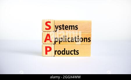 SAP, systems, applications, products symbol. Wooden blocks with words SAP, systems, applications, products. White background, copy space. Business and Stock Photo