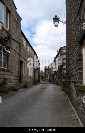 Heptonstall, West Yorkshire, a moorland weaving village high in the moors containing ancient sandstone workers cottages now gentrified Stock Photo