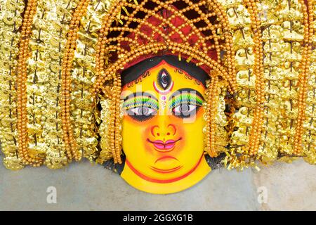 Colorful Chhau (or chhou) masks of Goddess Durga, handicrafts on display for sale - at Charida, Purulia - Bangla (formerly West Bengal), India. Stock Photo