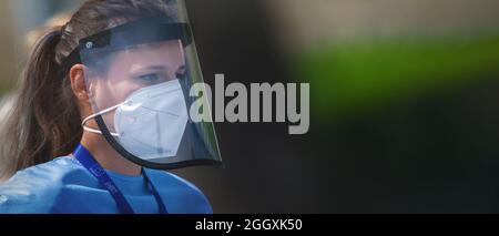 BRNO, CZECH REPUBLIC - Apr 24, 2020: A portrait of a female wearing a plastic face shield Stock Photo